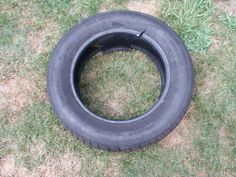 an old tire laying in the grass