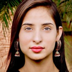 Traditional punjabi "dandi jhumki" in gold plated silver. The pearls are freshwater and the red and green stones are synthetic ruby,emerald look alikes. Red Jhumkas With Intricate Design For Diwali, Red Temple Jewelry Chandbalis With Intricate Design, Red Temple Jewelry Earrings For Navratri, Bollywood Ruby Danglers For Festive Occasions, Festive Ruby Chandbalis For Festivals, Festive Bollywood Ruby Earrings, Festive Red Jhumkas With Intricate Design, Festive Red Peacock Design Earrings, Festive Red Peacock Earrings