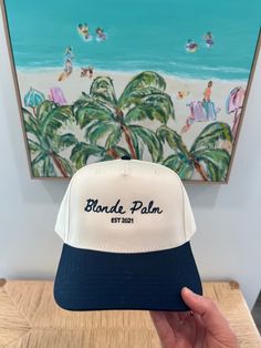 The perfect summer beach hat! This trucker hat is navy/natural with navy thread. Blue Baseball Cap For Beach Season, Blue Snapback Hat For Beach And Summer, Blue Snapback Hat For Beach Summer, Summer Beige Baseball Cap With Flat Brim, Blue Snapback Hat For Vacation, Navy Casual Snapback Hat For Summer, Adjustable Navy Baseball Cap For Beach, Navy Adjustable Baseball Cap For Summer, Navy Travel Hat With Curved Brim