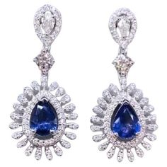 An exclusive pair of earrings in contemporary design, so elegant and refined style . Stunning earrings come in 18k gold with 2 pieces of Ceylon Sapphires , in perfect pear shape, fine quality and grade , and 170 pieces of Natural Diamonds, in mixed cut , of 2,10 carats. .F-G color VS clarity, very sparkly. Handcrafted by artisan goldsmith. Complete with AIG report. Extremely HIGH Quality Product. Shop with Confidence. We can offer free worldwide shipping, taxes free on my shipment. Earring Video, 18k Gold Bracelet, Modern Bracelets, 18k Gold Earrings, Gold Armband, Ceylon Sapphire, Refined Style, Sapphire Stone, Stunning Earrings