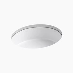 an overhead view of a white ceiling light against a white background with no lighting on it