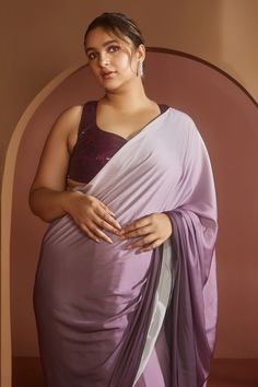 Purple ombre satin pre-draped saree crafted in satin. Paired with all over shimmer padded blouse featuring sweetheart neckline, thick straps, and a racer back.
Components: 2
Pattern: Embroidered
Type Of Work: Machine embroidered
Neckline: Sweetheart
Sleeve Type: Sleeveless
Fabric: Satin
Color: Purple
Other Details: 
Attached lining
Approx. product weight: 1 kg
Model height: 5ft 9inches, wearing size S
Occasion: Mehendi and Haldi - Aza Fashions Unstitched Draped Blouse Piece In Art Silk, Unstitched Draped Art Silk Blouse Piece, Silk Draped Blouse For Diwali, Diwali Draped Silk Blouse, Silk Draped Dupatta, Tissue Silk Draped Saree, Semi-stitched Silk Draped Blouse Piece, Semi-stitched Draped Silk Blouse Piece, Semi-stitched Draped Silk Saree