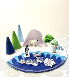 an assortment of toys on a table with snowflakes and ice floeses