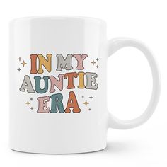 a white coffee mug with the words in my auntie era printed on it