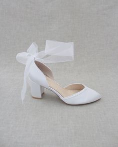 Smooth satin almond toe block heel perfect for all special occasions. Elaborated with matching satin or sheer ribbons that ties to an oversized bow around ankle to add dancerly grace to any ensemble. Perfect style for wedding, bridal shoes, bridesmaids, date-night, or any special occasions.DETAILS:HEEL HEIGHT: 2.75 inchesCOLORS AVAILABLE: Champagne, White, Ivory, Navy, Burgundy, and Light BlueUPPER: Synthetic upper and liningMATERIALS: Manmade outsoleSTYLE NAME: SALLY Elegant Ankle Tie Wedding Shoes With Wrapped Heel, Elegant Wedding Shoes With Ankle Tie And Wrapped Heel, Satin Heels With Heel Strap For Wedding, Low Heel Wrapped Bridesmaid Heels, Low Heel Bridesmaid Heels With Wrapped Heel, Low Heel Wrapped Heels For Bridesmaids, Elegant Heels With Satin Bow And Ankle Tie, Elegant Ankle Tie Wedding Shoes, Evening Wedding Shoes With Satin Bow And Ankle Tie