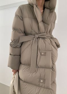 Stay warm and elegant this winter wearing our luxurious Queenie Coat. Crafted from superior goose down, this hooded, belted coat offers superior insulation and protection from the cold. Our exclusive design ensures that this coat is both stylish and comfortable; perfect for winter evenings. Details & care Fixed hood Front-button closure Lined, with 800-fill-power down 90% goose down, 10% feather Nylon Dry clean Women's coat Item #312901 Size info XS=US2=UK6=EU32 S=US4-6=UK8-10=EU34-36 M=US8-10=U Luxury Winter Parka With Double-lined Hood, Luxury Fall Hooded Jacket With Zip Fly, Luxury Nylon Hooded Jacket With Detachable Hood, Luxury Functional Down Hooded Jacket, Luxury Winter Raincoat With Double-lined Hood, Luxury Down Hooded Jacket With Adjustable Hood, Luxury Long Puffer Jacket With Detachable Hood, Luxury Women's Hooded Jacket With Double-lined Hood, Luxury Long Sleeve Puffer Jacket With Adjustable Hood