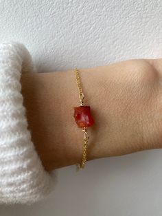 A beautiful raw crystal is combined with a dainty chain to create this  little  bracelet with healing properties. D E T A I L S  *It features a raw carnelian nugget in vibrant Fanta orange. Each of these in unique in shape and size measuring between 6/8mm. *Choose between an 18k gold/rose gold filled chain or a 925 sterling silver one. *It closes with a hall marked spring ring clasp measuring 6mm. *Bracelet comes care instructions and a matching crystal information card and is ready for gifting. S I Z I N G * H E L P Choose the length from the drop down menu. Use the length guide as a reference. This bracelet comes with a 1.5 inch extender chain as a snug fit works best to stop the crystal rolling. If unsure about the length you need - size down rather than up. C A R E *T I P This is a dai Carnelian Bracelet Jewelry Gift, Dainty Carnelian Gemstone Jewelry, Minimalist Rose Gold Crystal Bracelet For Gift, Minimalist Rose Gold Crystal Bracelet Gift, Raw Carnelian, Fanta Orange, Nugget Bracelet, Carnelian Bracelet, Carnelian Crystal