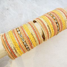 Beautifully designed bangles for any occasion. South asian bracelets come in a variety of styles, colors, and finishes. We at Banglez take creating the perfect bangle set for you to another level! You could say helping you find your favorite stack of bangles as one of our greatest missions. This bangle set was curated in house by one of our talented team members. We hope you love them as much as we do! Festive Stackable Bangle Bracelets, Traditional Stackable Bangle Cuff Bracelet, Stacked Bangle Bracelets As Gift, Orange Bracelet For Festivals As Gift, Bohemian Stackable Wedding Bracelets, Orange Bracelets For Festivals Gift, Orange Bracelets As Festival Gifts, Bohemian Orange Bangle Jewelry, Orange Festival Bracelet As Gift