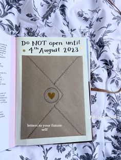 an open book with a heart on it