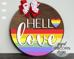 a wooden sign with the words hello love painted on it in rainbows and hearts