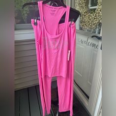 This Is A New 2 Piece Pajama Set From Juicy Couture. This Set Has A Sleeveless Racerback Top And Drawstring Long Pants. Great To Keep Or Give As A Gift Size Medium Pink Stretch Loungewear Sets, Pink Fitted Loungewear Set, Pink Workout Set For Spring, Pink Spring Workout Sets, Pink Workout Sets For Spring, Sleeveless Athleisure Loungewear Sets, Sleeveless Athleisure Sets For Loungewear, Pink Athleisure Loungewear Set, Ribbed Loungewear