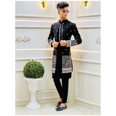 Designer Black Sets For Winter, Designer Black Embroidered Kurta, Designer Embroidered Black Kurta, Black Long Sleeve Designer Bandhgala, Designer Sherwani With Intricate Embroidery For Winter, Designer Black Nehru Jacket With Traditional Drape, Designer Winter Sherwani With Intricate Embroidery, Designer Black Kurta With Intricate Embroidery, Designer Black Kurta With Resham Embroidery