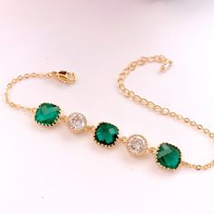 #jewelry #bracelets #chainlinkbracelets #dropearrings #dangleearrings #weddingearrings #bridesmaidearrings #bridalearrings #bridesmaidgift #studearrings #emeraldearrings #goldearrings #christmasearrings #jewerly #lalacrystal #gift for her Gold Plated Wedding Bracelets, Elegant Green Crystal Bracelets, Elegant Gold Plated Bracelets For May Birthstone, Green Crystal Bracelet For Wedding, Green Crystal Bracelet For Weddings, Gold Emerald Jewelry For Parties, Elegant Gold Crystal Bracelet As Bridesmaid Gift, Green Crystal Wedding Bracelet, Elegant Gold Crystal Bracelet For Bridesmaids