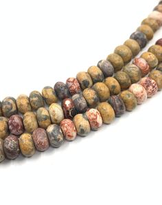 two strands of brown and white marble beads