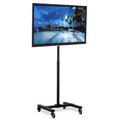 a flat screen tv sitting on top of a black stand