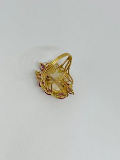 "This is a vintage 14K yellow gold, baroque pearl, marquise-cut ruby, and diamond floral-themed statement ring. There are a couple of gold leaves wrapping around the face of the ring. Material(s): 14K yellow gold + (2) baroque pearls + (8) marquise-cut rubies + (2) petite, round diamonds Weight: 4.6 grams Flaws (if any): None to mention Marking(s): \"14K\" + \"585\"(translating to \"14K\") BAND SIZE 5 3/4 (or 5.75) U.S." Gold Ruby Ring With Rose Cut Diamonds, Elegant Gold Ruby Ring With Rose Cut Diamonds, Luxury Marquise Ruby Gold Jewelry, Gold Marquise-cut Ruby Jewelry, Gold Ruby Marquise Cut Jewelry, Gold Marquise Cut Ruby Jewelry, Gold Ruby Jewelry With Marquise Cut, Elegant Marquise Gold Ruby Ring, Gold Multi-stone Pearl Ring In Fine Jewelry Style