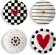 three plates with hearts on them and black and white checkerboard designs, one has a red heart in the middle