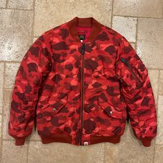 Bape Red Camo Ma-1 Bomber Jacket Size Medium Great Condition Measurements: Chest: 21” Length: 27.75” Sleeve Length: 26.5” Shoulders: 18.25” Red Military Long Sleeve Outerwear, Fitted Red Outerwear For Streetwear, Urban Red Outerwear For Outdoor, Red Urban Outerwear For Outdoor, Urban Red Outerwear With Pockets, Red Winter Streetwear Outerwear, Red Winter Outerwear For Streetwear, Bape Jacket, Red Camo