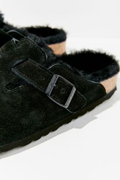 So cozy we can't believe these suede clogs from Birkenstock. The coziest clog around with a soft suede upper lined in fluffy shearling with an adjustable buckled strap across arch and a cushy EVA sole. Content + Care Suede, shearling, EVA Spot clean Imported Size All sizes in narrow width | Birkenstock Boston Shearling Clog in Black at Urban Outfitters