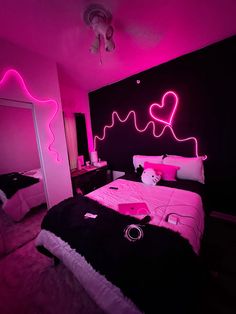 a bed room with a neatly made bed and neon lights