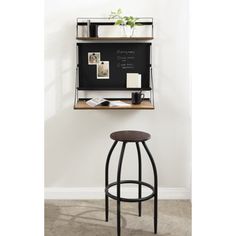 a black and brown bar stool next to a wall mounted chalkboard