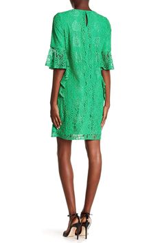 This pretty Nanette Lepore ND8S10S99 shift dress is a lovely option for your next day out. This full lace overlay dress features a jewel neckline, three-quarter length asymmetrical bell sleeves and features a keyhole at the back with button closure on top. This sheath silhouette dress finishes at mini length. Pair this effortless casual dress by Nanette Lepore with wedges or flat sandals for a look that's bound to make you feel your most chic. Style: imap_ND8S10S99 Details: Lace overlay, Asymmet Spring Knee-length Lace Dress, Green Shift Dress For Party, Spring Sheath Shift Midi Dress, Spring Sheath Midi Shift Dress, Chic Green Shift Dress, Casual Knee-length Lace Dress For Spring, Casual Knee-length Spring Lace Dress, Chic Green Lace Dress For Summer, Mini Length Lace Dress For Daywear