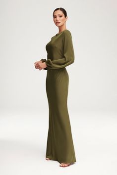 Indulge in luxury with the Kamila Satin Maxi Dress in Olive Night. The elegant balloon sleeves and bias cut design flatter your figure, giving you a sophisticated and exclusive look. Made from smooth satin, this dress will make you feel like a work of art, elevating your style to new heights. Model is 5'7" and is wearing XS/58". Modest Green Dress, Olive Maxi Dress, Women Nightwear Dresses, Night Wear Dress, Satin Dresses Long Sleeve, White Dress Formal, Nikkah Dress, Elegant Dresses Classy, Black Satin Dress