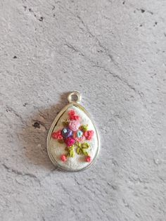 A beautiful hand embroidered pendant by me ...Each piece is made with love and attention to details. These delicate handcrafted beauty just adds the right touch of elegance and glamour to your outfits and ensembles. Bohemian Embroidered Jewelry For Wedding, Feminine Handmade Flower Jewelry For Gifts, Bohemian Embroidered Jewelry For Celebration, Handmade Teardrop Necklaces For Wedding, Pink Embroidered Jewelry As A Gift, Handmade Delicate Jewelry For Celebrations, Handmade Teardrop Necklace For Wedding, Delicate Handmade Jewelry For Celebrations, Traditional Handmade Flowers Jewelry As Gift