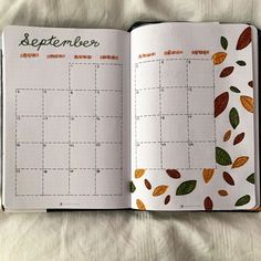 an open planner book with leaves on the pages and numbers in each page, which are numbered by month