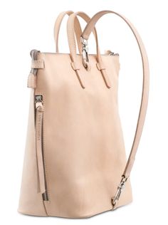 Our Diego Sling is a versatile bucket bag that makes it easy to store your essentials in style. Our sling can be worn in multiple ways: as a crossbody, over the shoulder, or held by its leather handles. The bag features a natural, untreated leather exterior and is lined in beige canvas. A laptop up to 13" fits comfortably inside. Details & Sizing Interior slide pocket and credit card pocket Beige canvas lining Includes two detachable straps: a leather shoulder strap and an adjustable woven c Modern Hobo Bag With Long Strap For Travel, Modern Hobo Bag With Long Strap For Daily Use, Modern Leather Shoulder Bag With Long Strap, Everyday Top Handle Shoulder Bag With Long Strap, Modern Bags With Long Strap For On-the-go, Leather Tote Bag With Long Strap, Leather Crossbody Hobo Bag With Long Strap, Modern Leather Bag With Long Strap, Modern Leather Bags With Long Strap