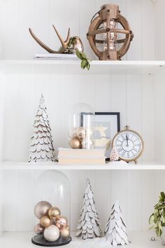 white shelves with christmas decorations and ornaments on them