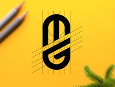 the letter s is surrounded by two pencils on top of a yellow paper with black lines