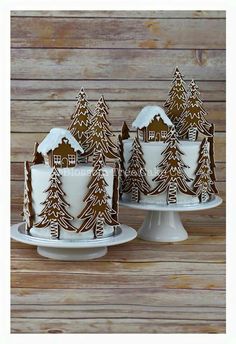 three cakes decorated with gingerbread trees and houses