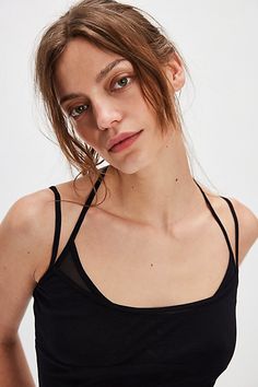 Get that effortlessly layered look with this twofer tank, featuring a mesh underlay and sweet lettuce-edge trim. **Fit:** Slightly relaxed, semi-cropped **Features:** Layered design, scoop neckline, mesh underlay, solid overlay, skinny adjustable straps, halter strap, lettuce-edge trim **Why We | Double Up Mesh Tank Top by Intimately at Free People in Black, Size: L Spring Mesh Tops With Built-in Bra, Summer Mesh Tank Top With Built-in Bra, Summer Mesh Camisole With Built-in Bra, Mesh Camisole Tops For Summer, Summer Mesh Top With Built-in Bra, Spring Mesh Cami Top, Spring Camisole With Tank Straps For Layering, Spring Crop Top With Mesh Back And Stretch, Mesh Camisole Tank Top For Summer