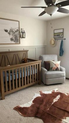 a baby's room with a chair, crib and rug