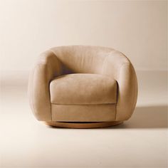 a chair that is sitting in the middle of a room with a white wall behind it