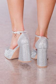 Details Silver Sparkle Chunky Heel Buckle closure Heel height: 4" Material and Care Made of man made materials Materials may have natural variations Colors may vary from different viewing devices. If you are returning a pair of shoes: Shoe boxes must be encased in another box for shipping to protect the items. If you send shoes back with stickers and return labels directly on the box, or if the shoe box is damaged, then we will not accept a return. Chunky Heels Sparkly, Silver Sparkling Block Heel Shoes, Silver Rhinestone Closed Toe Heels, Silver Platform Heels With Closed Toe, Silver Glitter Closed Toe Heels, Single Diamond Ring, Gold Knot Earrings, Sparkle Heels, Cocktail Dress Wedding Guest