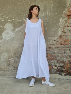 "This long double gauze cotton dress (muslin) has wide strings so you can regulate the length and three layers. Ideal for the summer days and nights either in the city or beach side. Two side pockets. You can also be creative and have your own color combination. ✥ Welcome to my world! I create my design in my dreams and I draw geometric lines and extravagant patterns with scissors, needles and thread. Be my dream catcher and let me create for you a parallel fashion world! ✥ SHIPPING Express ship Airy Sleeveless Maxi Dress For Daywear, Summer Cotton Maxi Dress With Tie Straps, Cotton Maxi Dress With Tie Straps For Summer, Cotton Sleeveless Dress With Tie Straps For Vacation, Flowy Sleeveless Linen Dress For Daywear, Airy Sleeveless White Dress, White Airy Sleeveless Dress, Airy White Sleeveless Dress, Breezy Sleeveless Cotton Maxi Dress