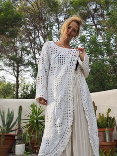 White vintage crochet long jackets up-cycled by Vagabond Ibiza We hand source vintage 1960’s and 70’s unique one off a kind textiles, crochet, knitted and woven and up-cycled them in to one off a kind unique jackets here in our Ibiza studio. Due to the nature of the recycled textiles there could be some slight imperfections but we see this as part of its beauty. Made by hand with love. Size is medium Condition is perfect Handmade Bohemian Crochet Long Sleeve Top, Handmade Bohemian Long Sleeve Crochet Top, White Bohemian Hand Knitted Outerwear, Bohemian Long Crochet Dress, White Bohemian Handmade Outerwear, Bohemian Long Sleeve Crochet Dress With Open Knit, Bohemian Long Sleeve Open Knit Crochet Dress, Bohemian Long Sleeve Crochet Dress For Fall, Bohemian Long Sleeve Crochet Dress For Festival