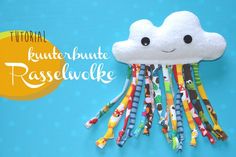 a white cloud with colorful hair clips attached to it's side and the words, cutest minute rasswickle