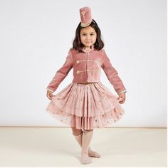 We've given the Nutcracker soldier a fabulous feminine update! This pink soldier costume is crafted from sumptuous velvet, tulle and gold lamé. A wonderful gift for hours of imaginative play during the festive season and beyond. Suitable for 3-4 years. The dusty pink velvet coat has gold lamé details on the trims and epaulettes, gold glitter cord braiding and gold star details, easily open and close the coat with the stylish gold poppers. The tutu skirt features layers of pink tulle, with a gold Pink Soldier, Tutu En Tulle, Nutcracker Costumes, Soldier Costume, Astronaut Costume, Tulle Cape, Gold Glitter Stars, Nutcracker Soldier, Christmas Costume