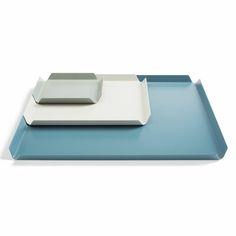 a blue tray with two white plates on it