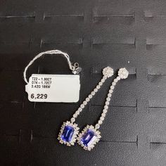 LAST CALL, LAST CHANCE!!! LIQUIDATION SALE!!!The Following Item we are offering is a Rare Important Radiant 18KT Gold Large Rare Fancy Gorgeous Fancy Emerald Cut Glittering Tanzanites and Diamond Dangle Earrings. Earrings are comprised of Beautiful Glittering Tanzanites and Round Dangling Diamonds set in 18KT White Gold!!! T.C.W. approx 4CTS!!! These Gorgeous Earrings are a Rare Sample Pair New With Tags from a Private Manufacturer that sold to Important 5 Star Hotel and Fine Jewelry Stores. Ori Rare Diamond, 5 Star Hotel, Snowflake Necklace, Liquidation Sale, Tanzanite Diamond, Earring Box, Diamond Dangle Earrings, Fancy Diamonds, Star Hotel