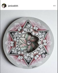 a white plate with an intricate design on it