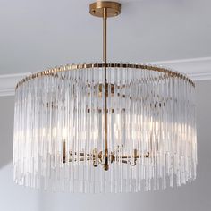 a chandelier hanging from the ceiling in a room