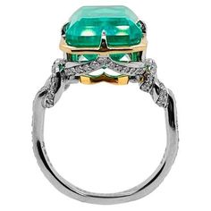 *Custom design to order * Our showstopper 3carat Zambian emerald "Forget Me Knot" ring is smothered in diamonds set in a combination of 22ct yellow gold and platinum with D/Fsi grade diamonds set down band. Please message our design to start the design process and custom sizing. (Images are an example of a 6ct emerald in the same style. ) Please message us to start the selection of your emerald. Luxury Diamond Ring With Emerald Accent Stones, Luxury Emerald Ring For May Birthstone, Luxury Emerald Birthstone Ring For Promise, Luxury Emerald Birthstone Promise Ring, Octagon Emerald Ring With Diamond Accents, Luxury Emerald Ring With Asscher Cut Center Stone, Luxury Diamond Ring For May Birthstone, Dazzling Diamond Emerald Ring With Accent Stones, Dazzling Emerald Ring With Diamond Accent Stones