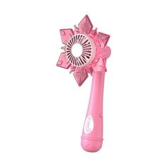 a pink electric hair dryer on a white background