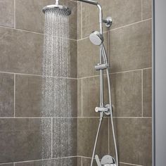 The European-designed Grohe Vitalio Flex Shower System redefines pure shower enjoyment with an all-in-one system that revitalizes you every time you step into the shower. The sleek, contemporary-style kit consists of a fixed 7 in. Rain showerhead and a 4 in. handshower with a metal hose, as well as a 24 in. rail and all mounting supplies, including adhesive and optional screws. The handshower offers four spray settings—Rain, RainO2, Jet and Massage—each optimized with GROHE DreamSpray technology to ensure even, consistent coverage. GROHE SpeedClean nozzles make maintenance a breeze, requiring only a quick wipe to remove limescale buildup. No extra tools are required for installation, as the shower system easily installs using existing wall outlets. The Vitalio Flex shower system is manufac Double Shower Heads, Grohe Shower, Bathroom Shower Heads, Dual Shower Heads, Master Shower, Shower Fixtures, Bathroom Remodel Shower, Rainfall Shower Head, Modern Shower