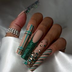 Indulge in luxury this holiday season with our Green Glitz press on nails. The extra long length and square shape add a touch of sophistication, while the festive plaid print and candy cane stripes bring a playful charm. The vibrant green color will make your nails stand out at any holiday event. __________________ •100% Handmade nails made by our in-house nail techs • Reusable, with up to 4 weeks of wear • Gel-coated to prevent polish chipping and to maximize durability __________________ These