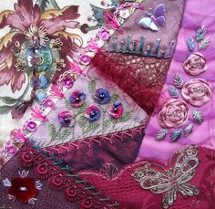 a patchwork quilt with flowers and butterflies on it's side, in shades of purple